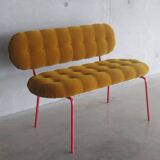 Upholstered bench with tufting