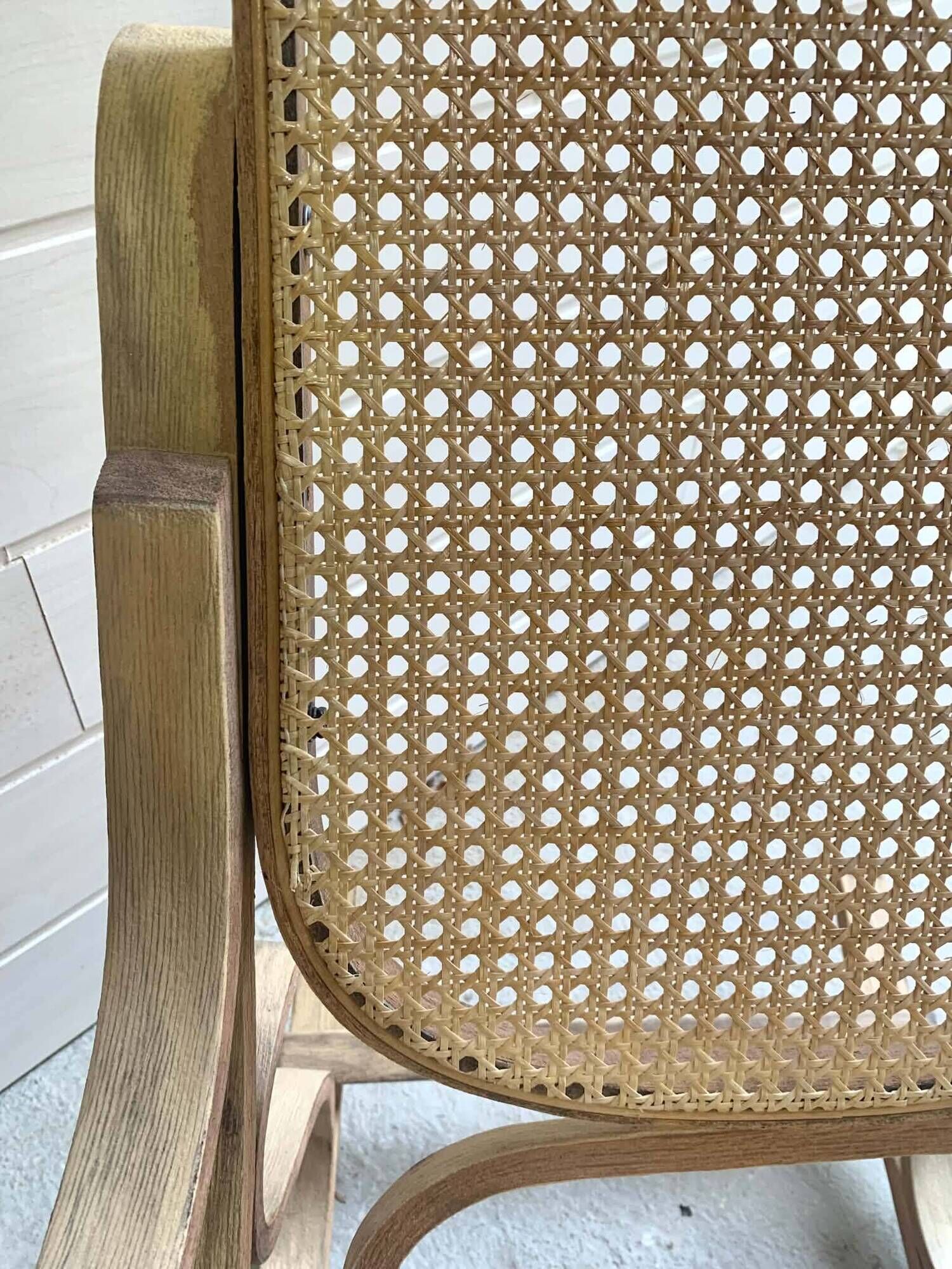 Rocking chair with a cane seat and backrest.