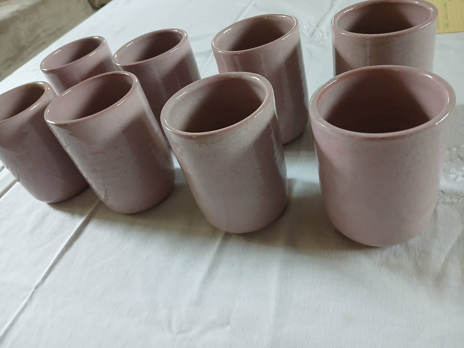 8 signed enamelled ceramic mugs