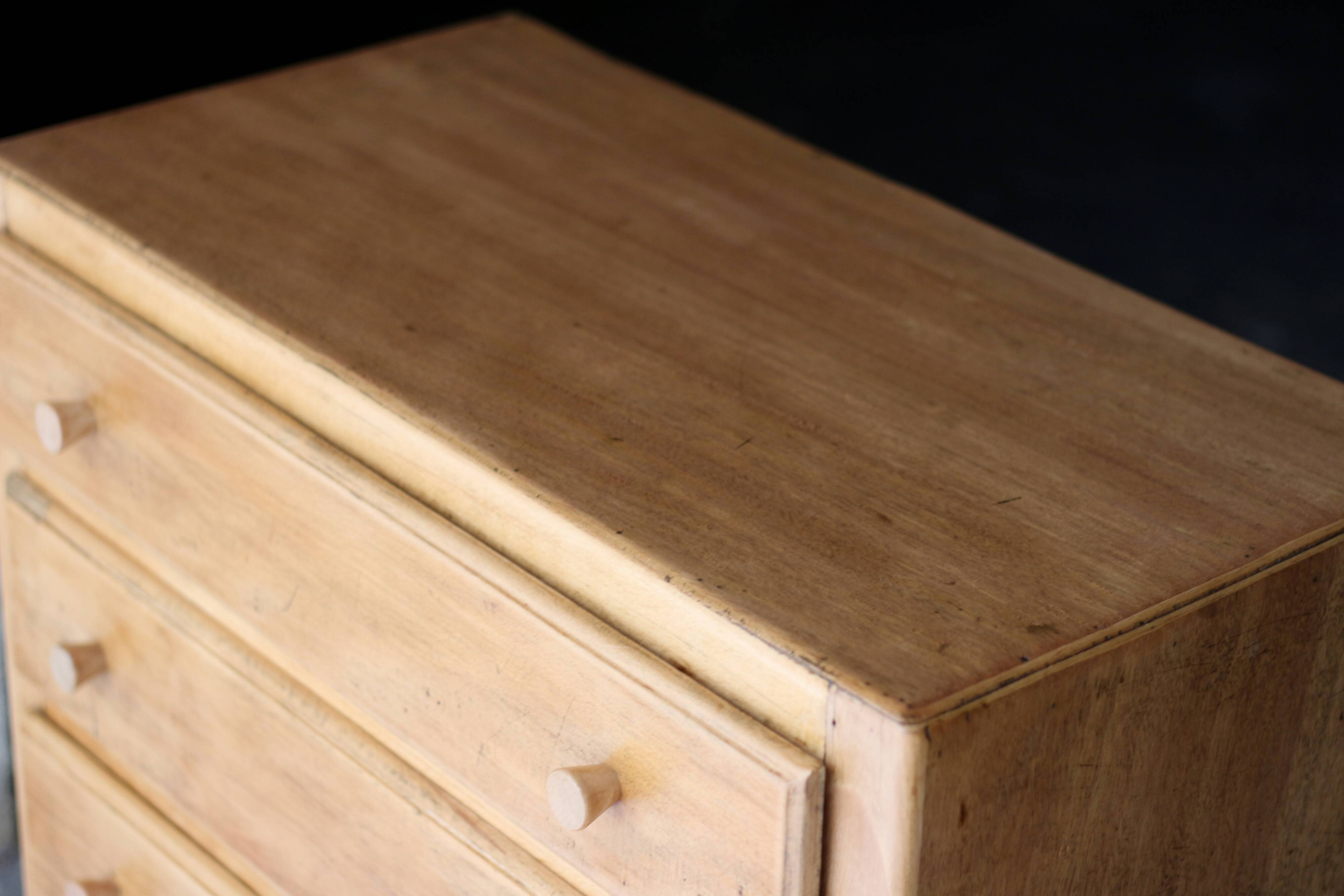 Small art deco chest of drawers in natural wood