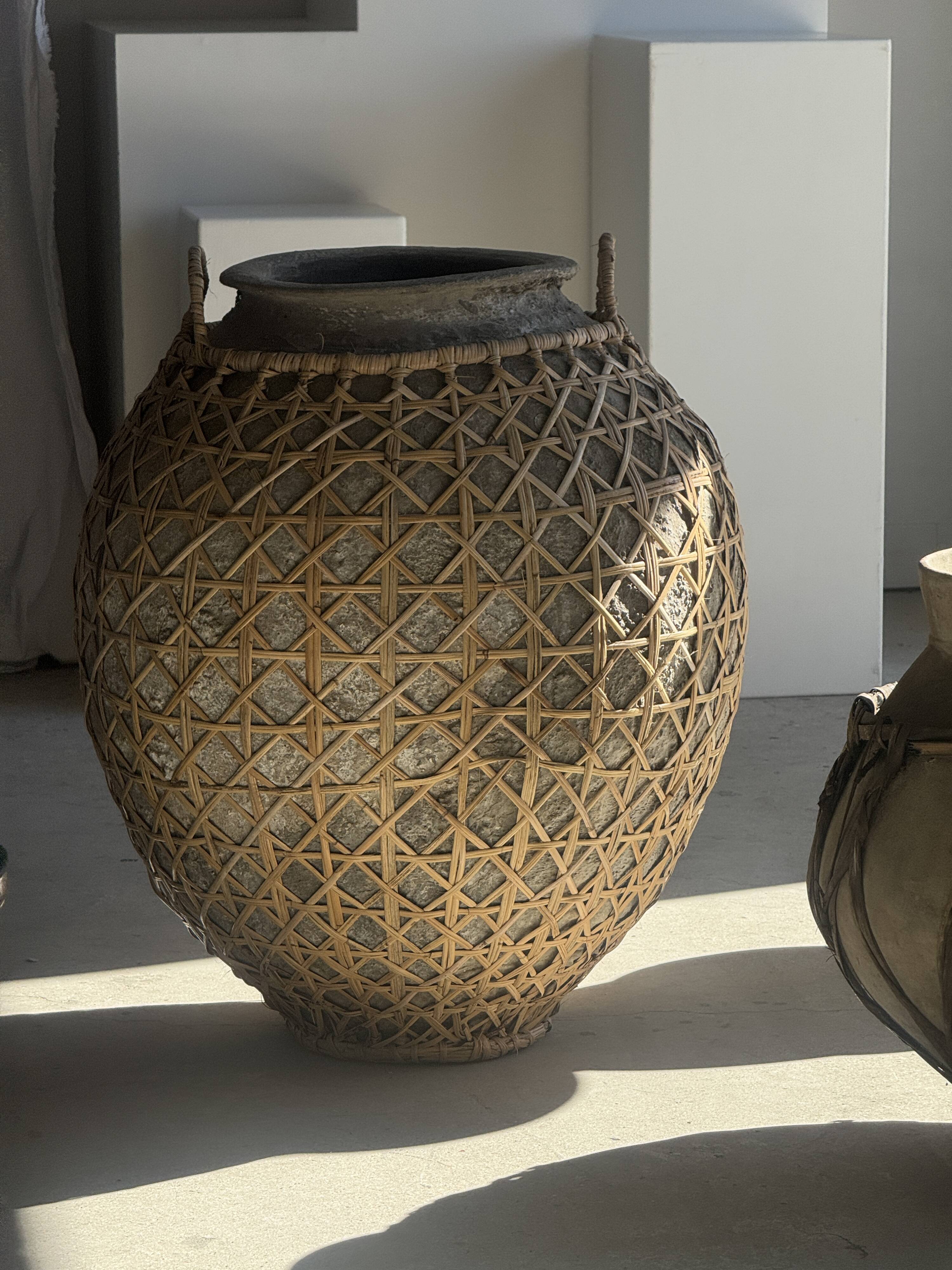 Immense light grey antique-style pot with a crosshatch lid and handles.