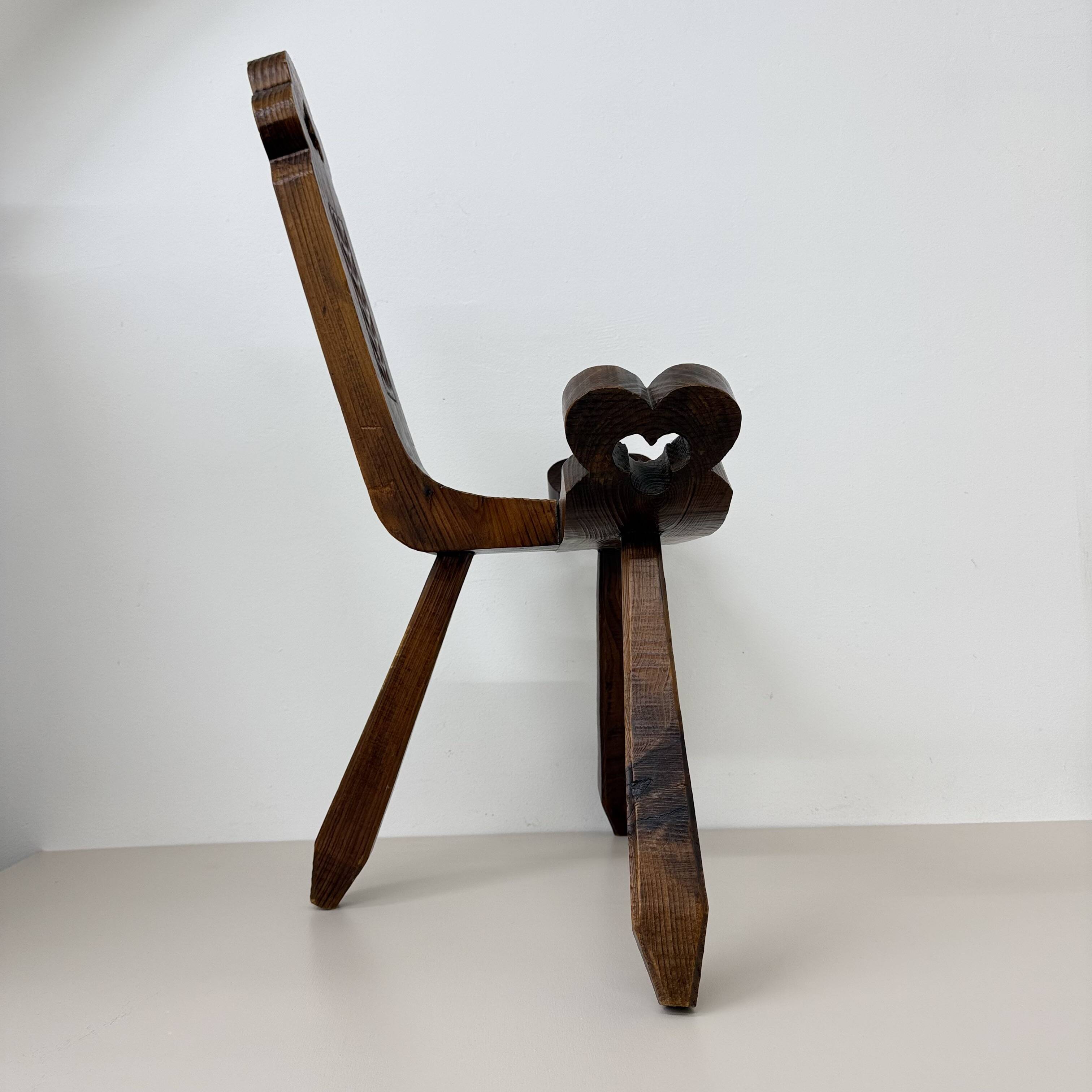 Brutalist hand carved oak Spanish tripod chair , 1970s