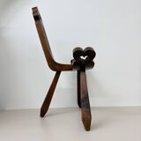 Brutalist hand carved oak Spanish tripod chair , 1970s