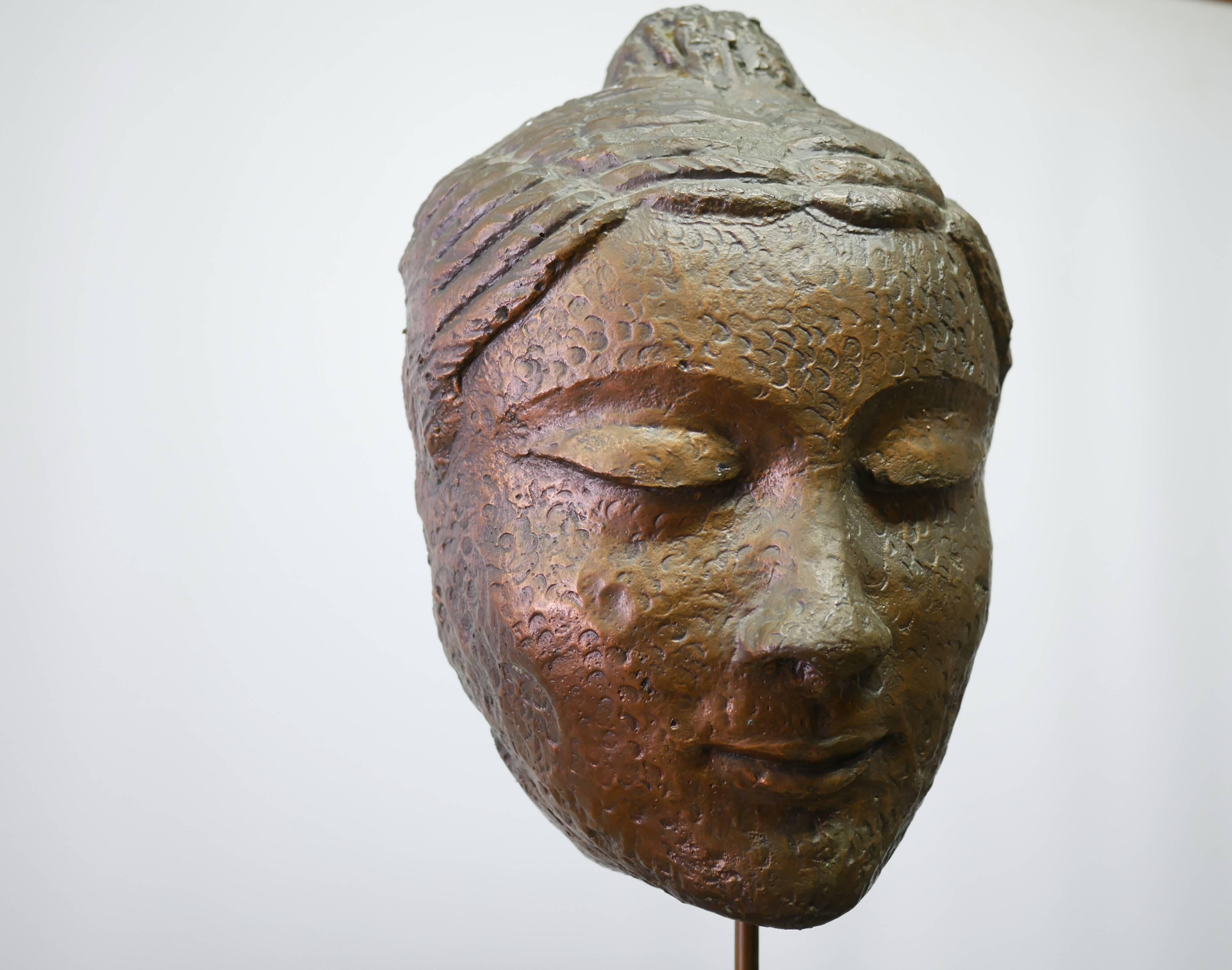 Buddha head sculpture, marble base