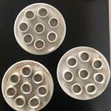 Three ceramic snail plates