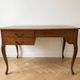 Retro wooden desk with curved legs