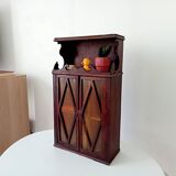 Small antique wall cabinet in Gothic style.