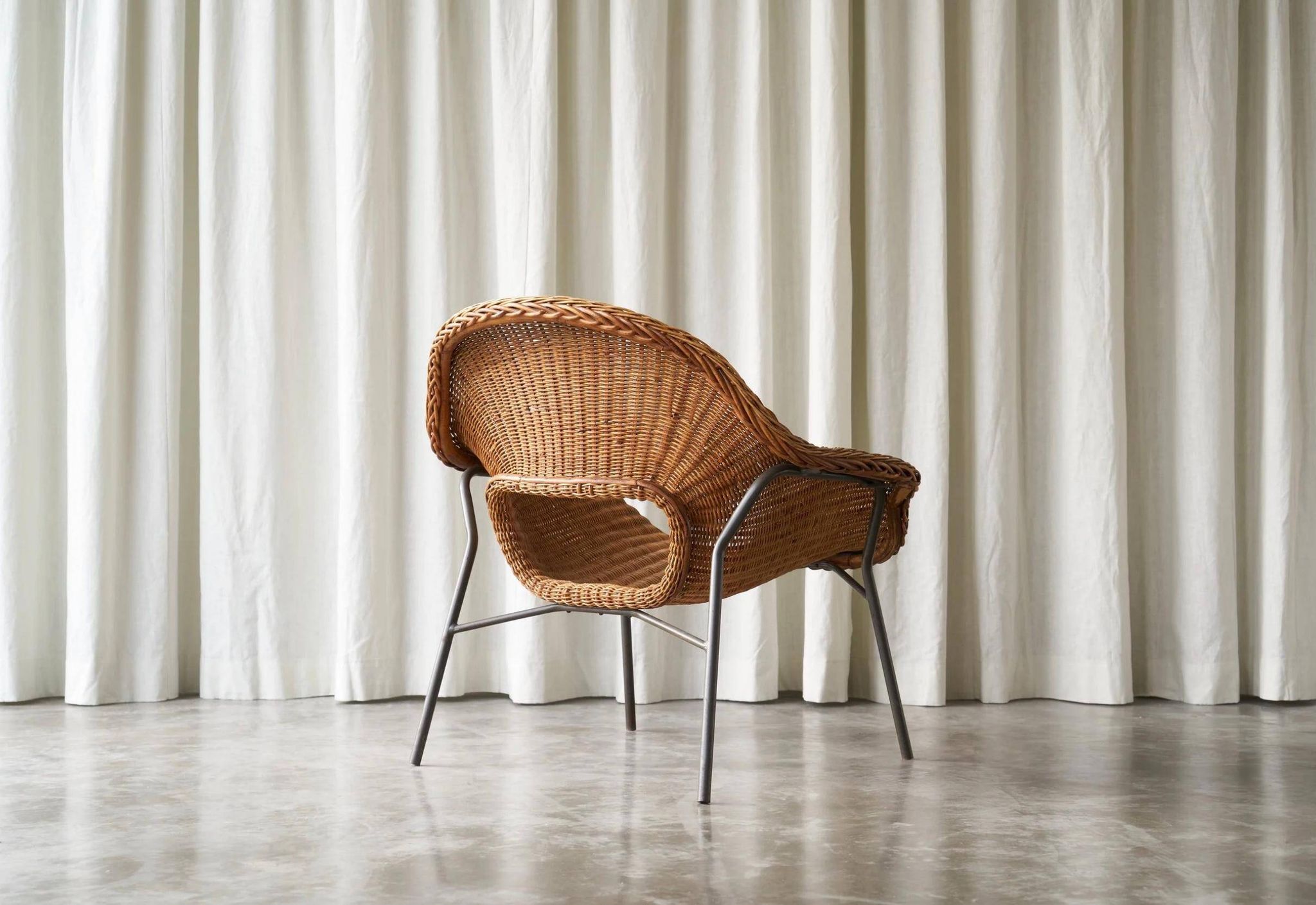 Sculptural lounge chair in rattan and metal, 1960s