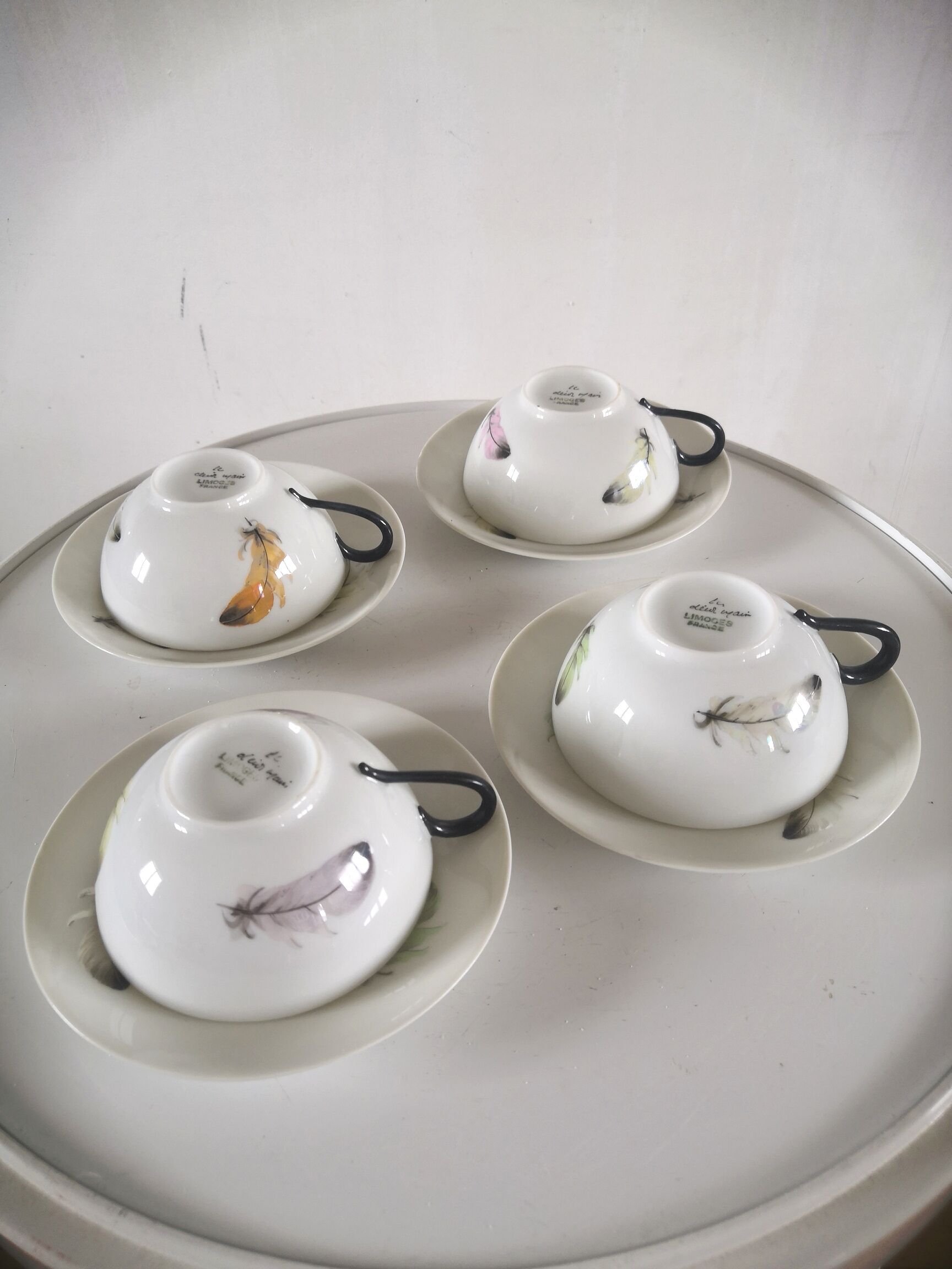 4 cups and cups in fine Limoges porcelain signed LC 60s