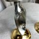 Pair of silver and gold metal candlesticks