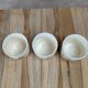 Set of 3 vintage ceramic cups with floral decoration.