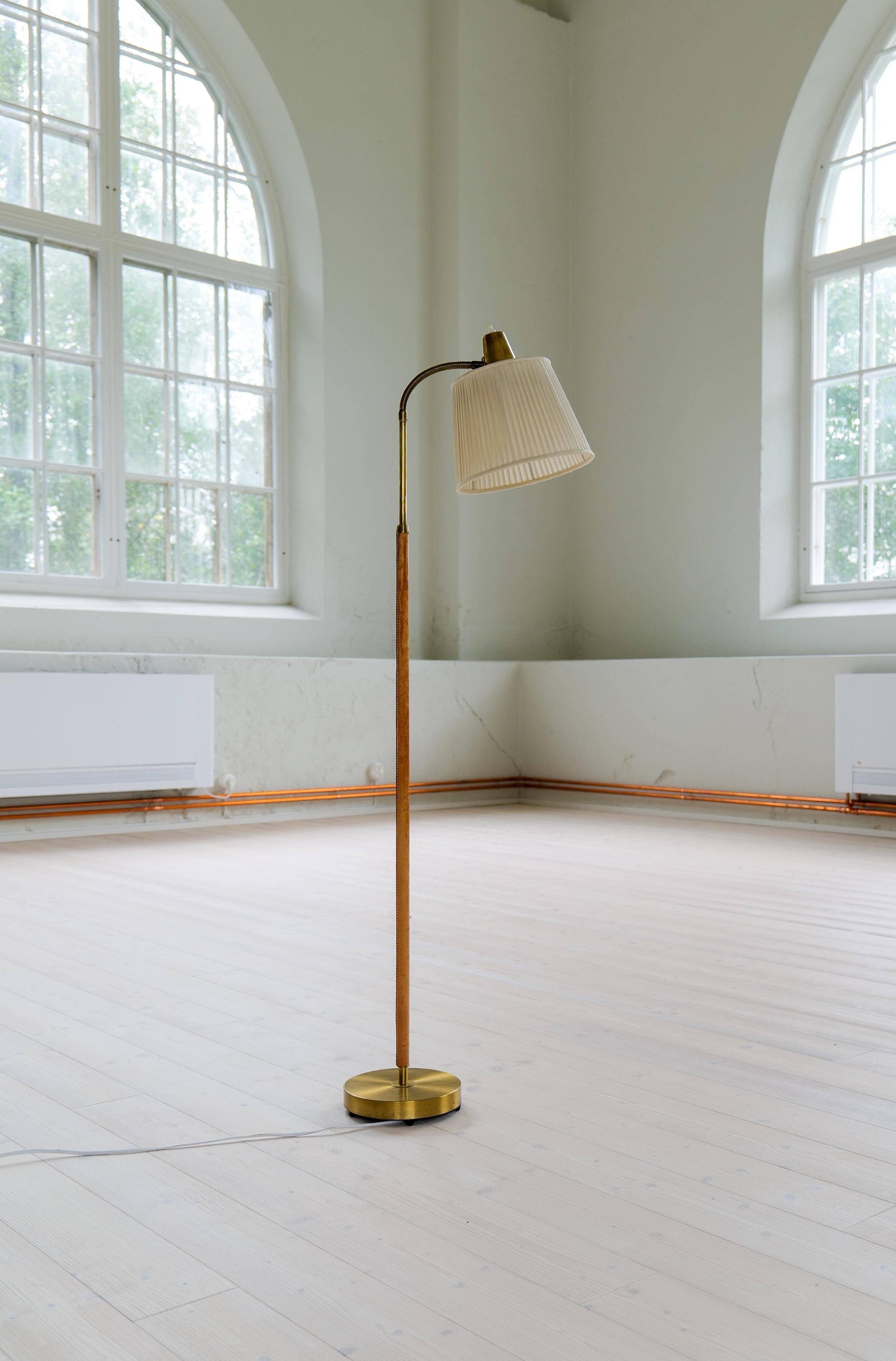 Mid-century brown leather and brass floor lamp, Falkenbergs Belysning, Sweden, 1960s.