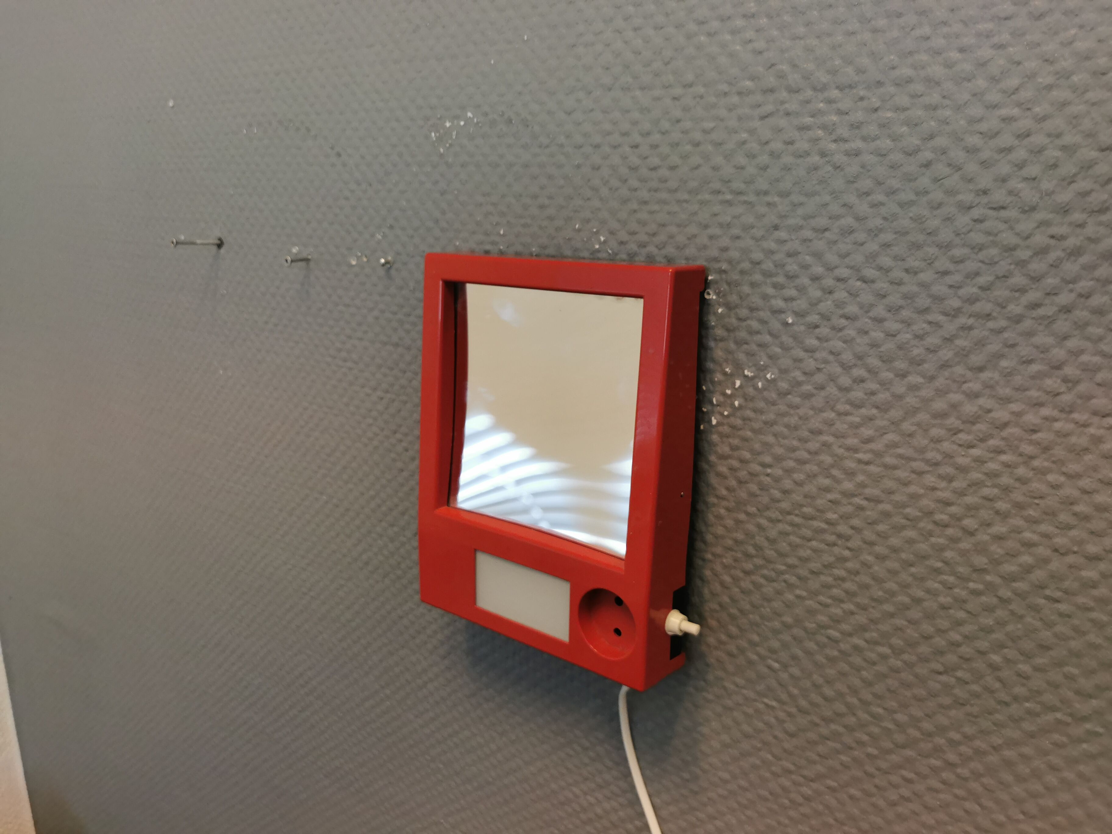 Red danish make up mirror with light and power plug from the 1970