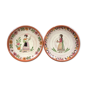 Lot of 2 plates with character decorations.
