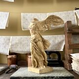 "Winged Victory of Samothrace", beige plaster statuette