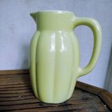 Yellow pitcher in earthenware