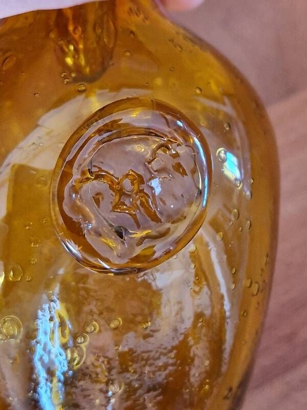 Biot perfume bottle or bubbled glass bottle in amber colour, 1970s design.