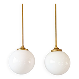 Pair of Art Deco pendant lights in brass and white opaline, 1920-30