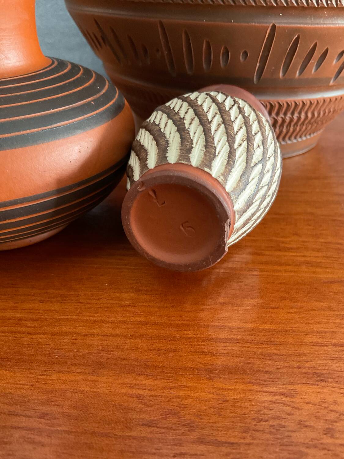 Trio of vintage vases in chiselled terracotta