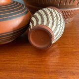 Trio of vintage vases in chiselled terracotta