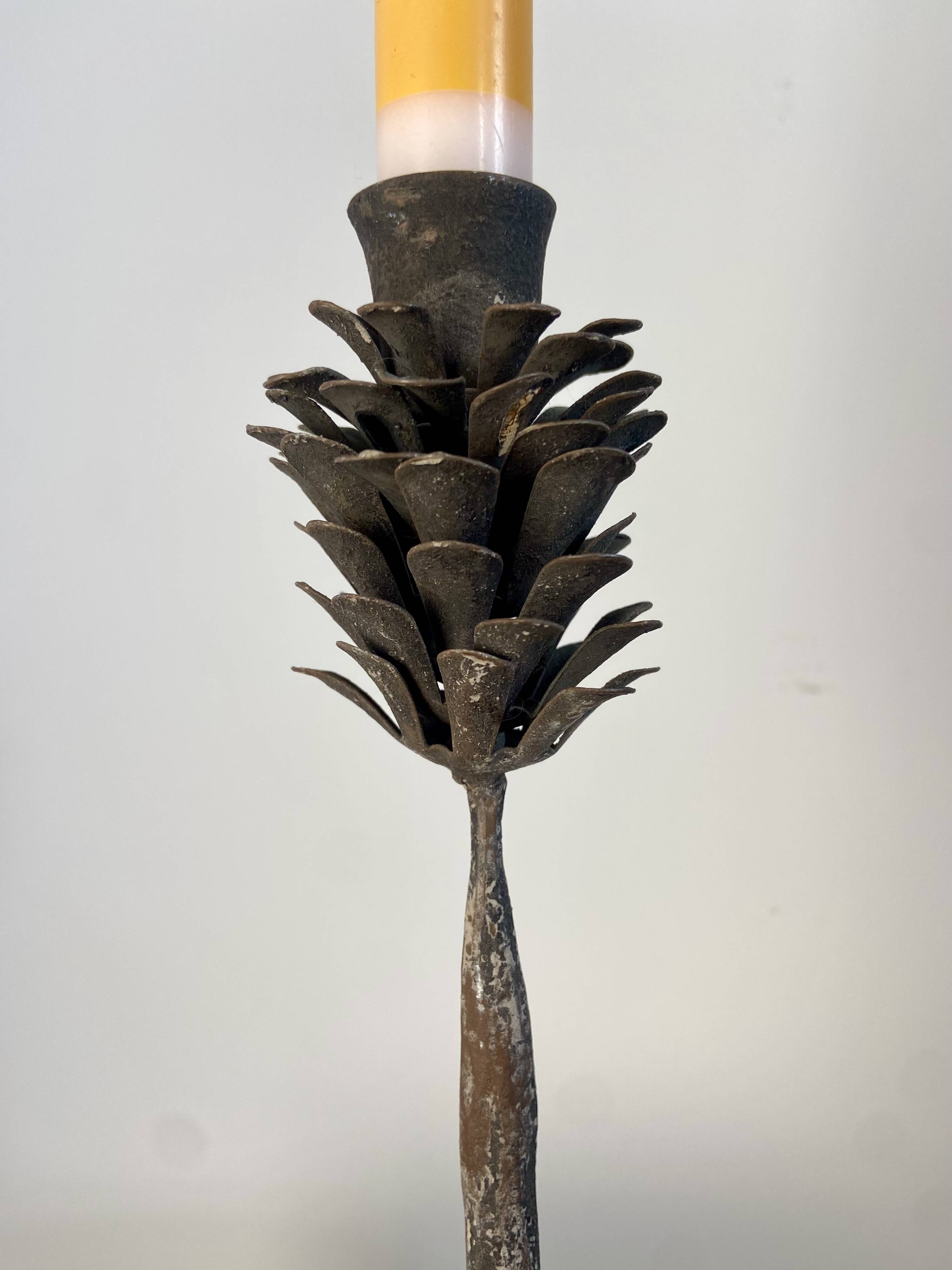 Metal pine cone candle holder
