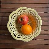 Yellow openwork woven earthenware basket