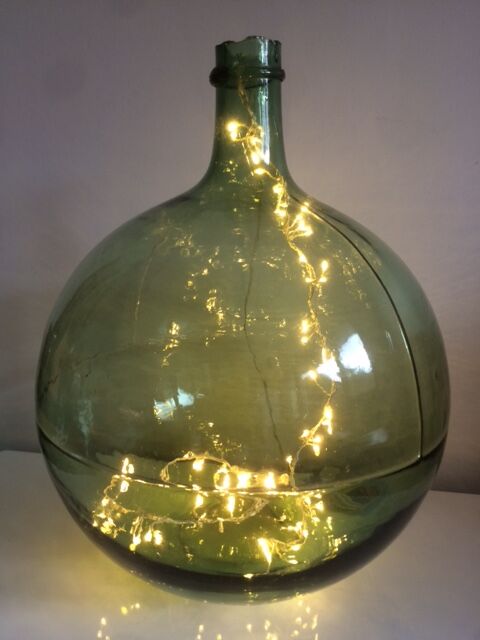 Demijohn old transparent green, estimated capacity around 12 to 15L