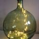 Demijohn old transparent green, estimated capacity around 12 to 15L