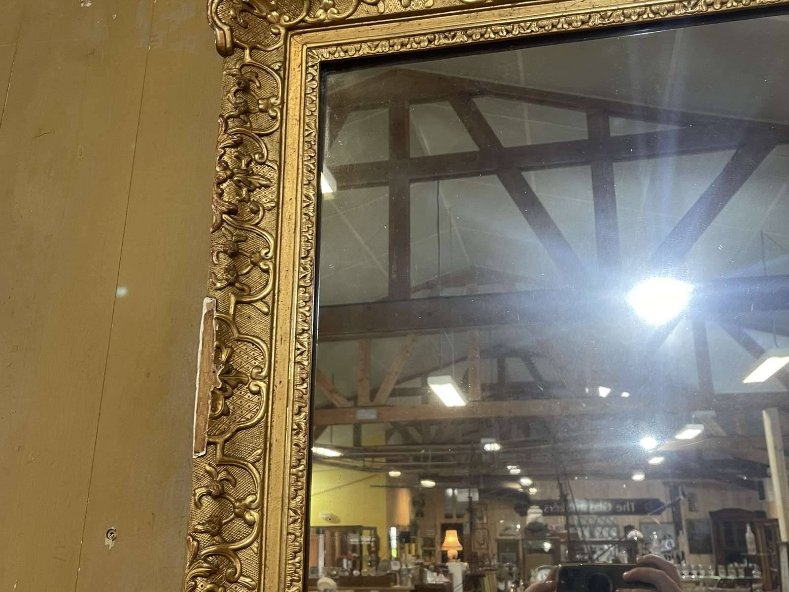 18th century Regency mirror in gilded wood