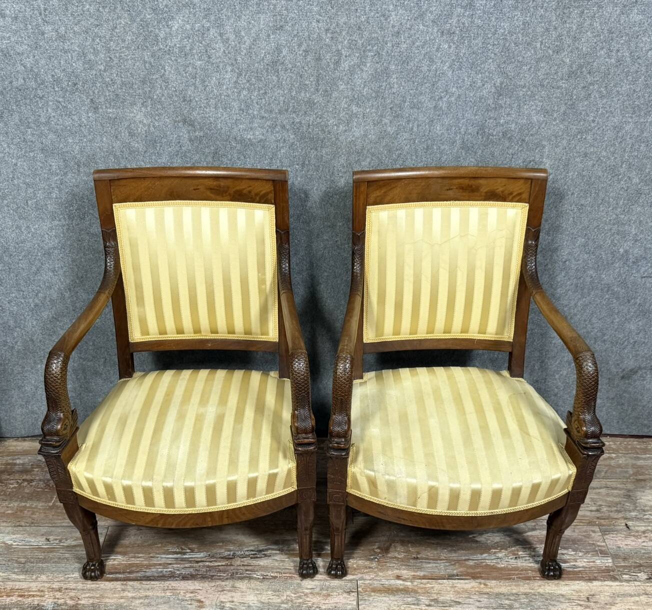 Pair of Empire period mahogany dolphin armchairs