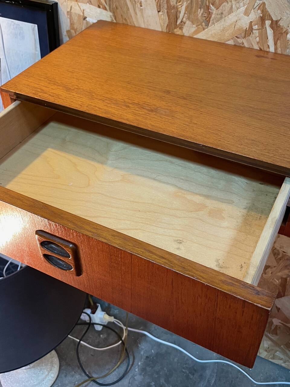 Suspended teak bedside tables in vintage 1960s Scandinavian style.