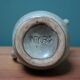 Small ceramic pitcher enamelled pale green, signed Max Idlas