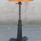 Height-adjustable leather stool with cast iron base
