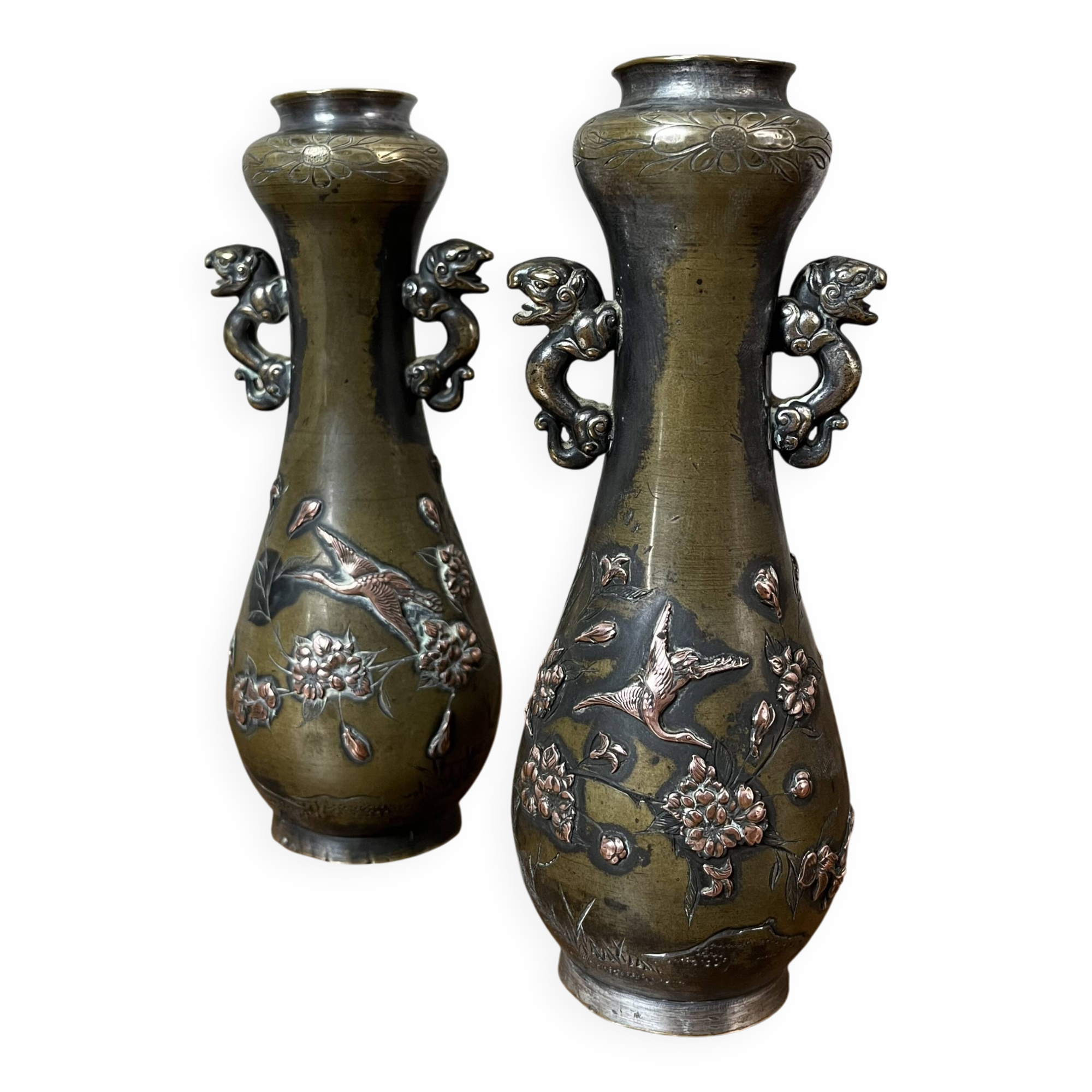 Pair of bronze vases - Asian motifs in relief in copper