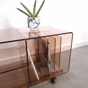 Vintage hifi, LP cabinet, TV unit made of tinted plexiglass on wheels, records.