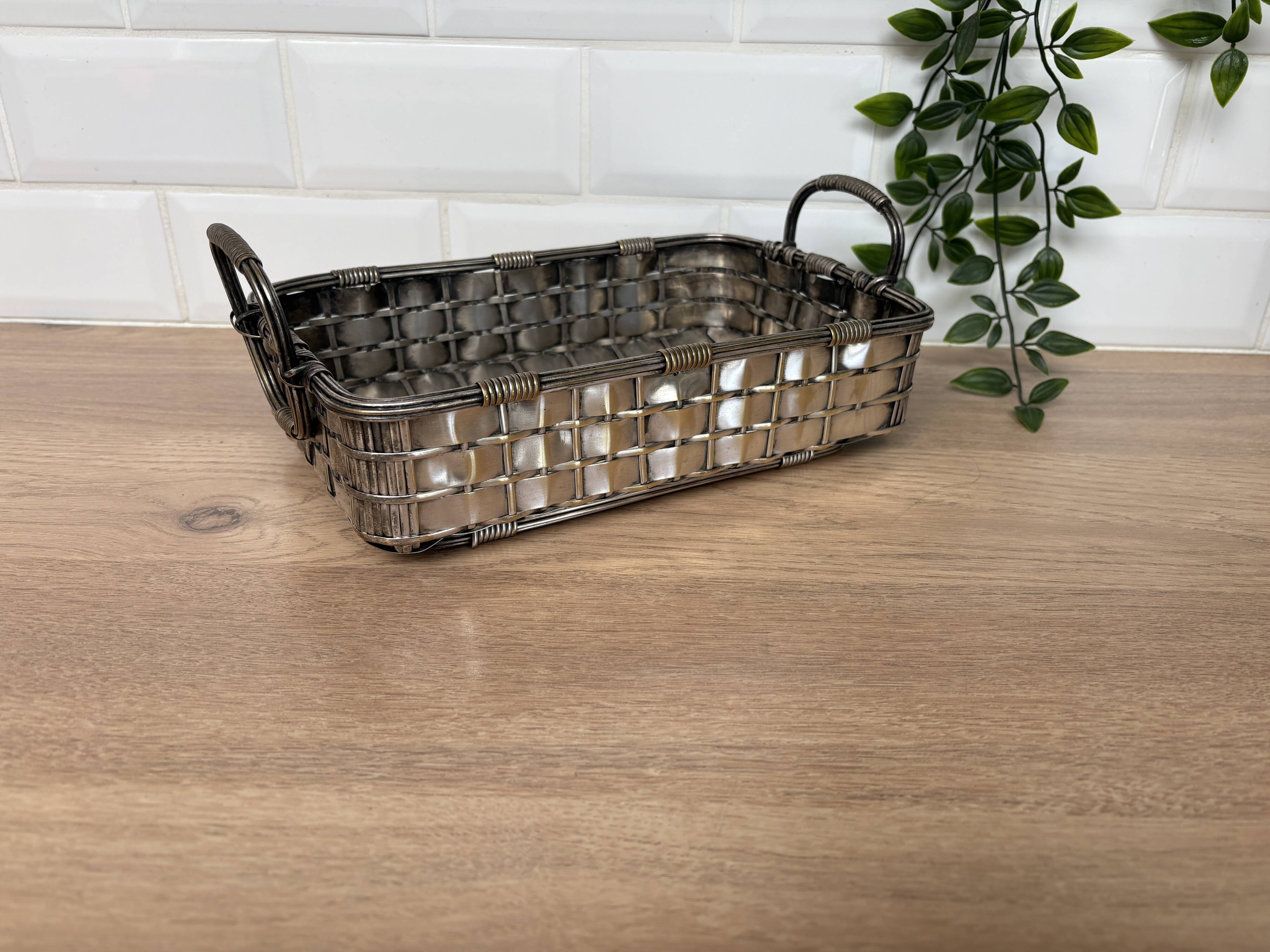 Woven silver-plated metal basket.
