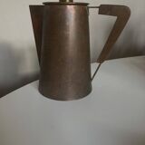 Modernist Italian pitcher design from the 1960s in patinated wood and metal.