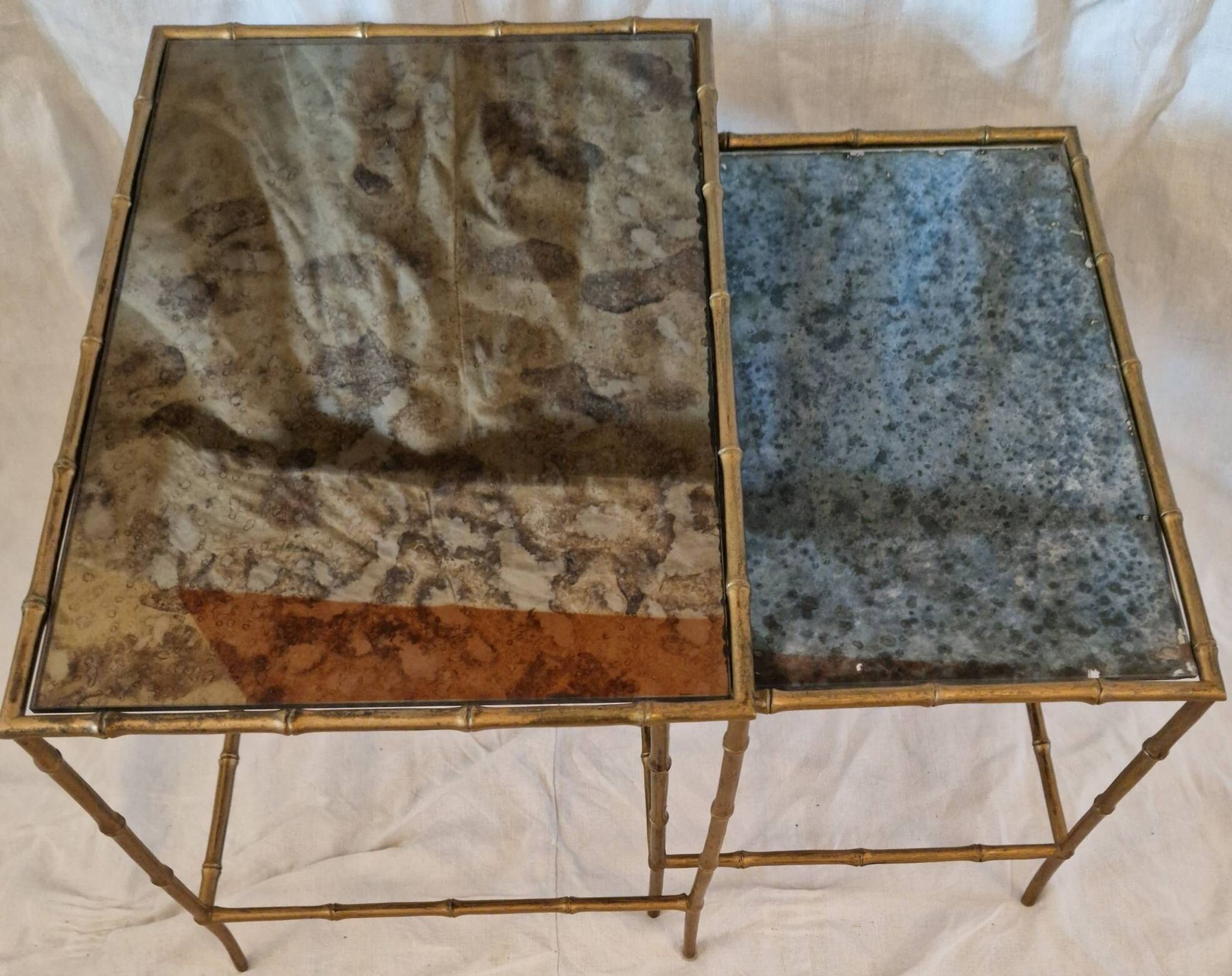 Pair of vintage nesting tables in faux bamboo with a gold finish – distressed mirrors
