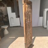 Rectangular Indonesian construction element with blue and yellow plant in carved wood