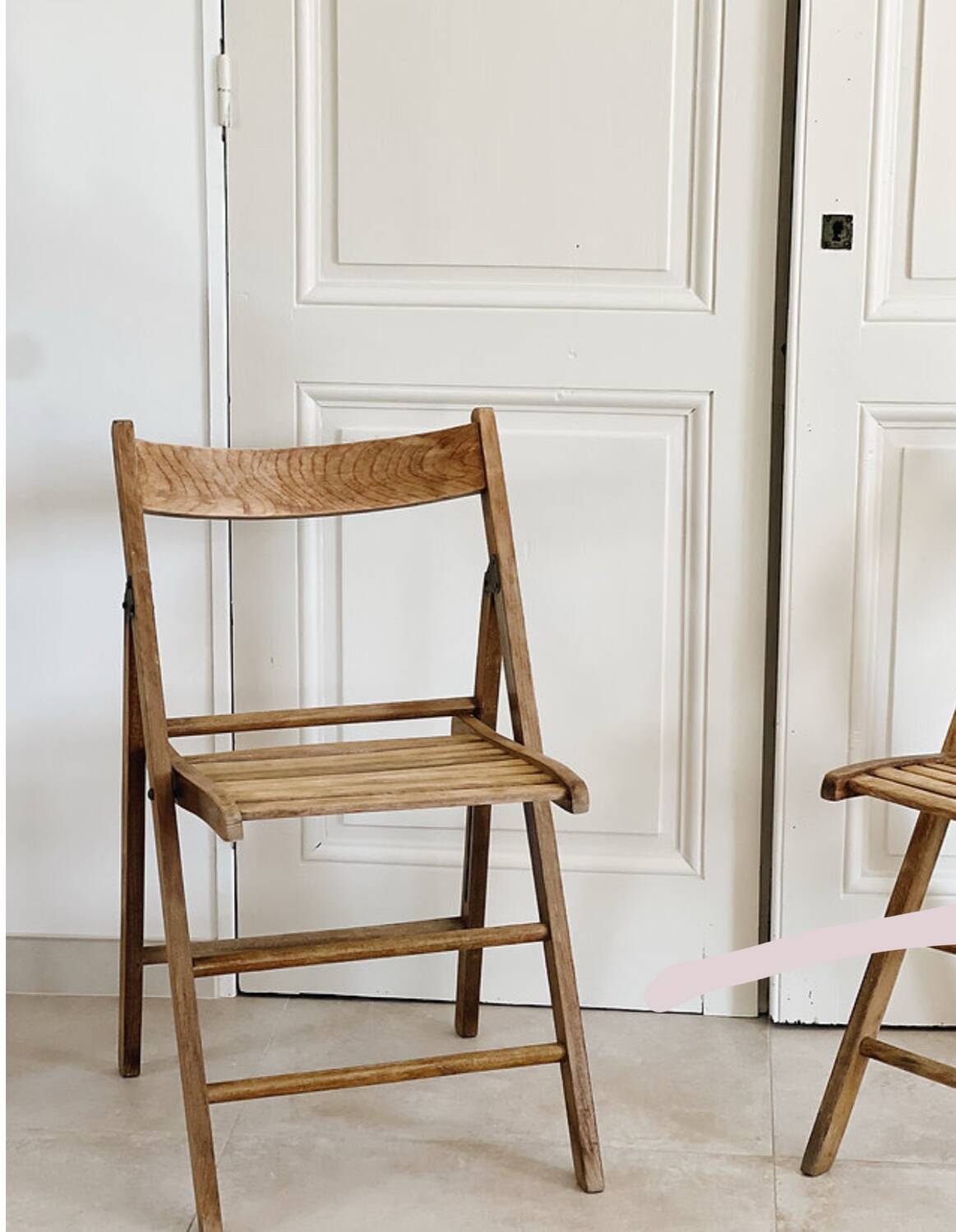 Pair of folding wooden chairs