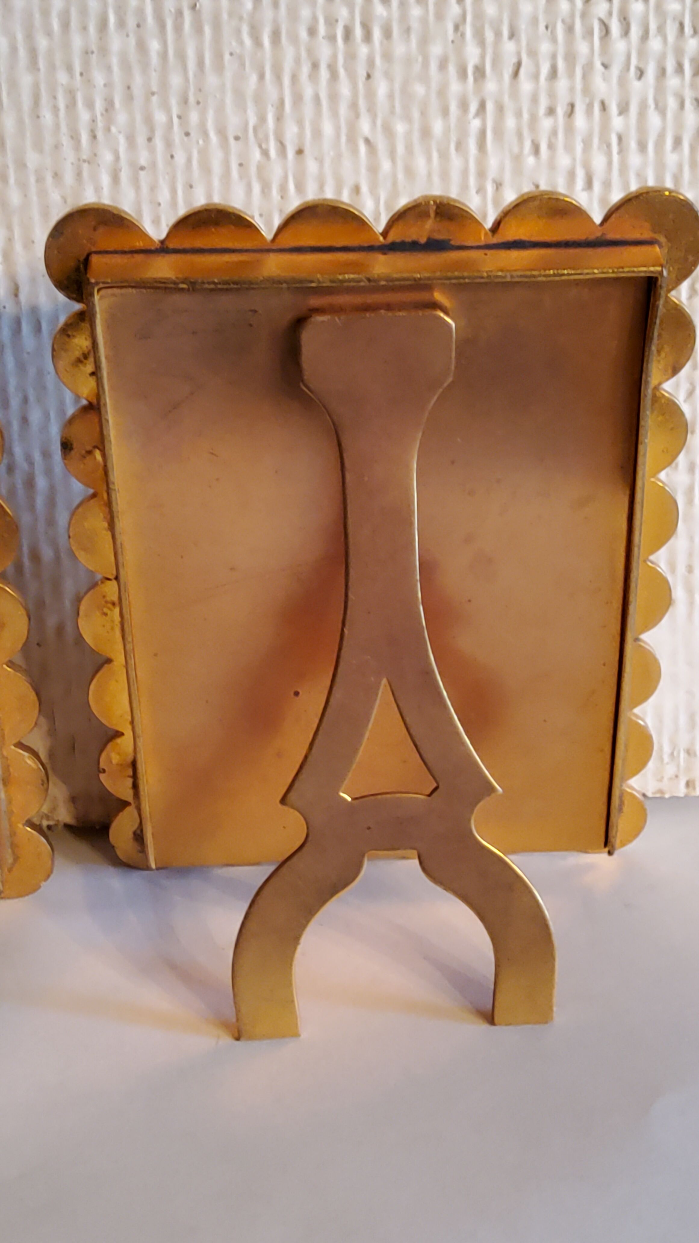 Pair of art deco photo frames in gilded bronze and gilded brass