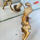 Louis XV bronze wall light with a flowing branch design and acanthus leaf decoration.