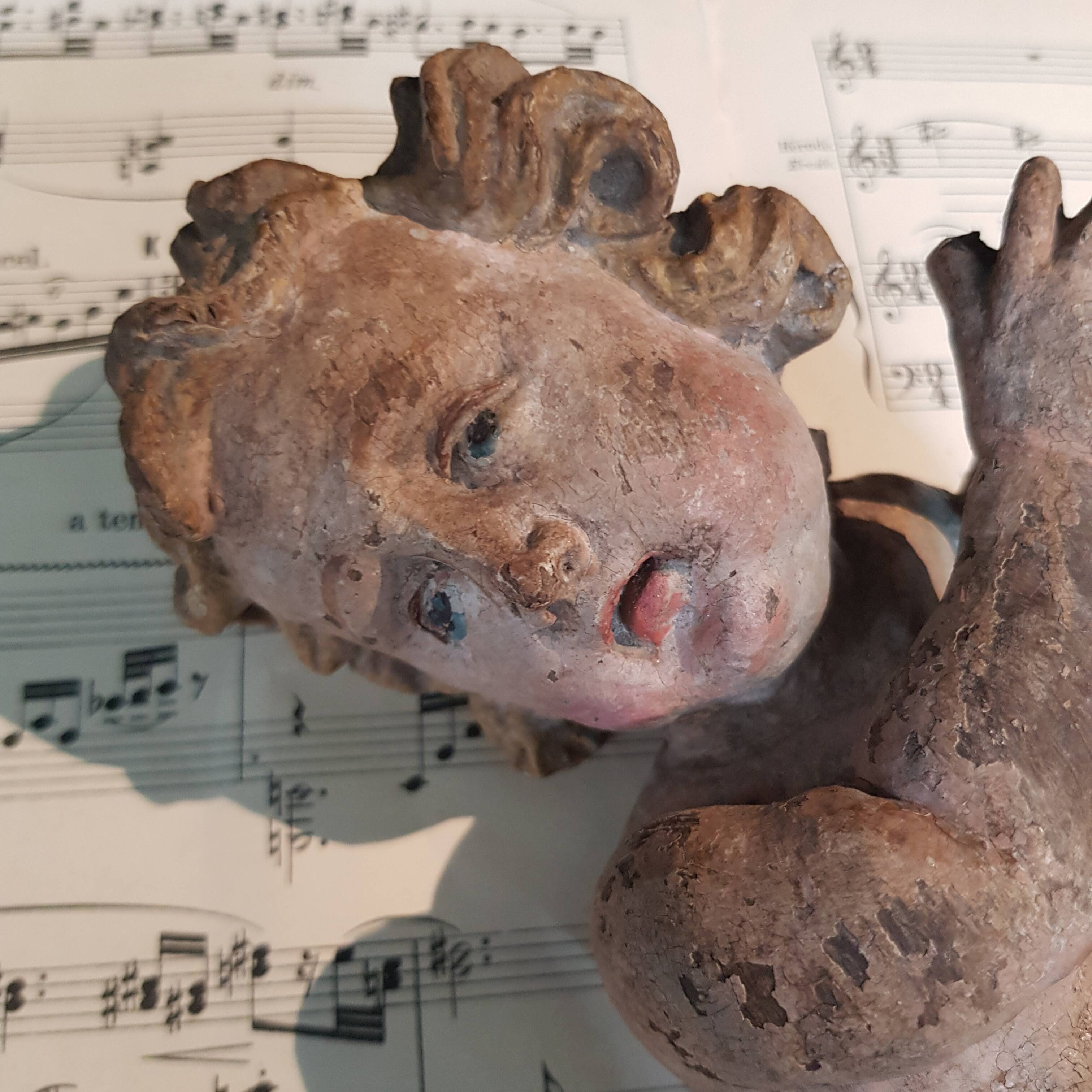 Carved wooden cherub or putto