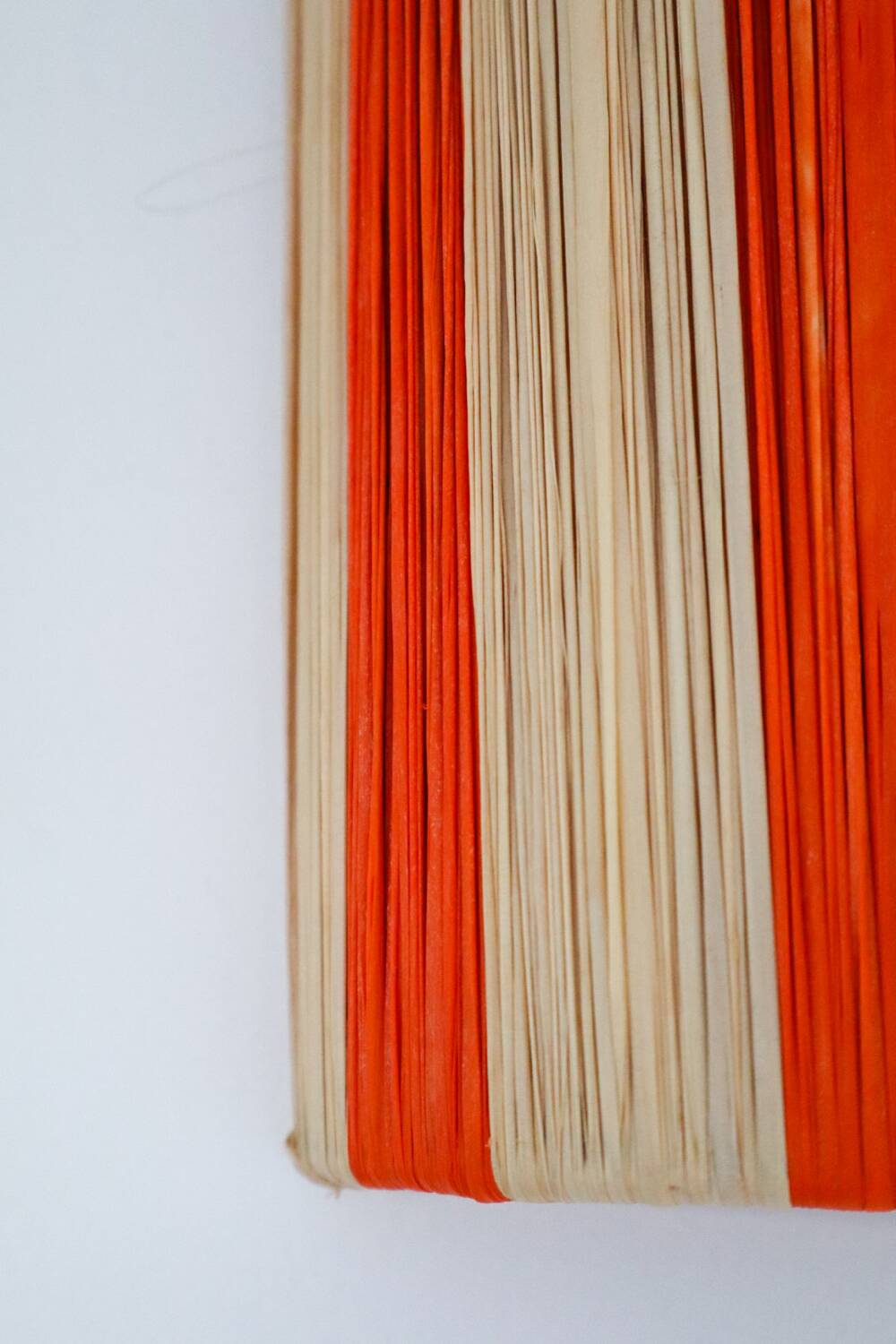 Orange and natural striped raffia wall light