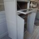 Small vintage piece of furniture sublimated in a linen shade, wooden top.