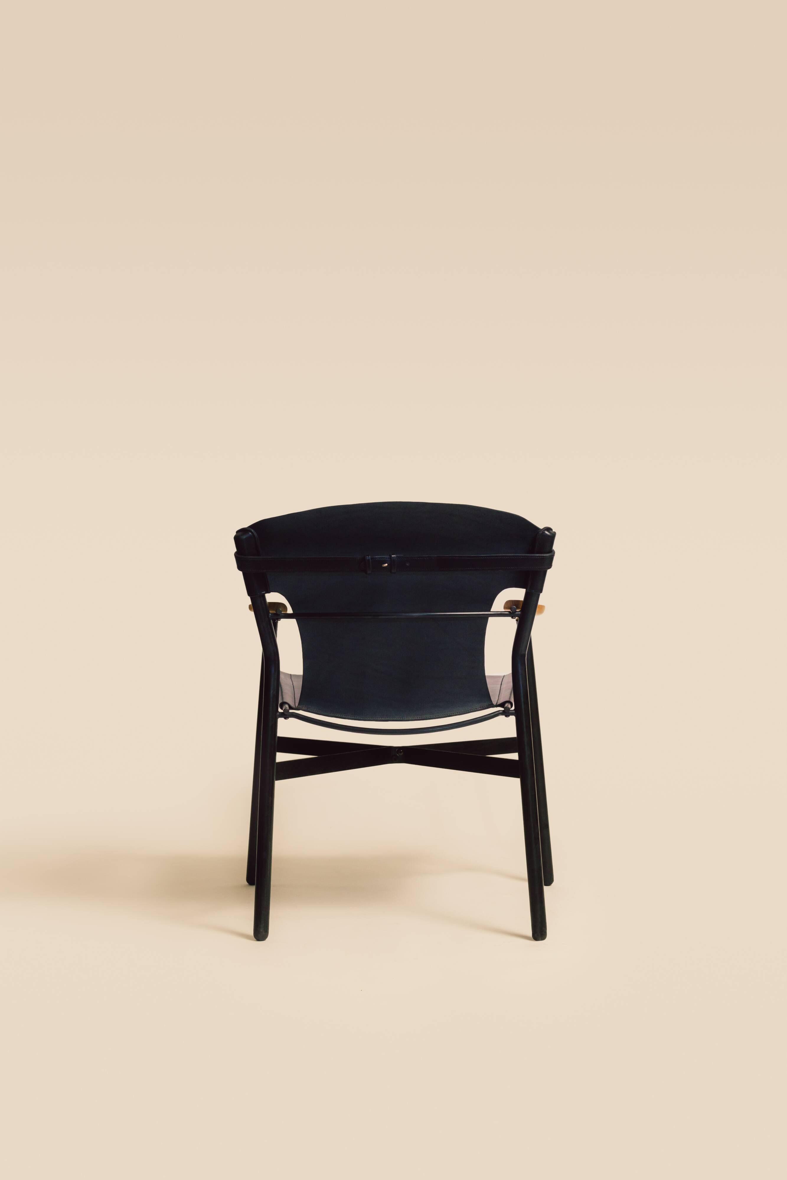 Maërl armchair, Galathée model, black leather, solid wood armrests of your choice