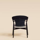 Maërl armchair, Galathée model, black leather, solid wood armrests of your choice