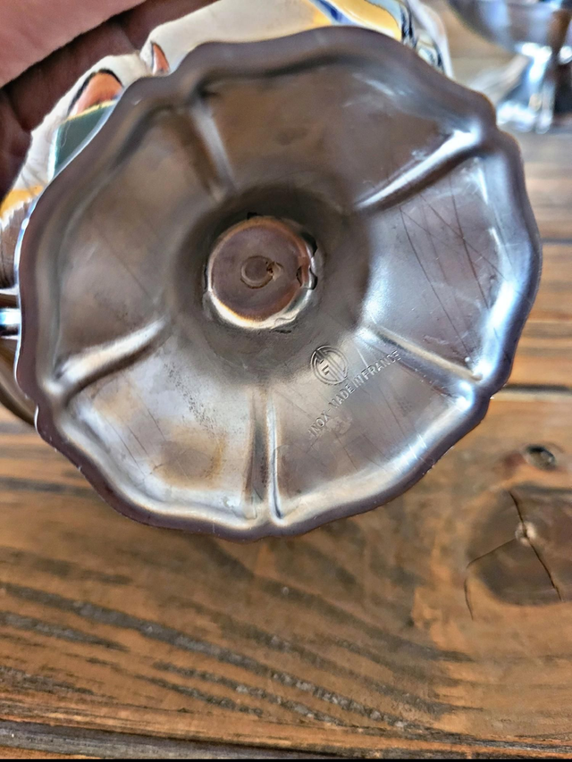 Stainless steel ice bowls by Guy Degrenne, low bowls in the shape of a flower.