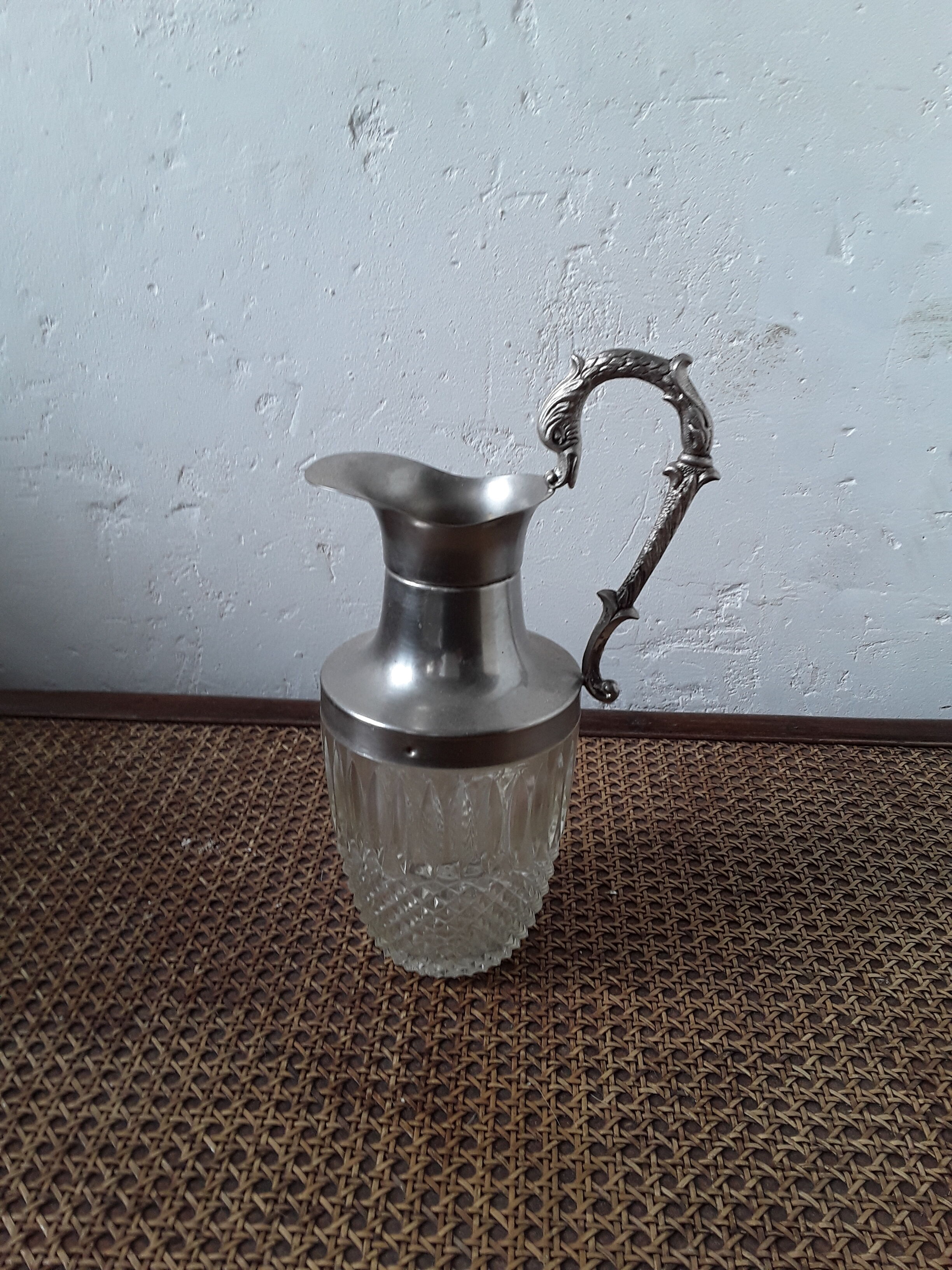Old glass and silver metal wine carafe