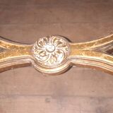 Oval coffee table in gilded wood in the Louis XVI style.